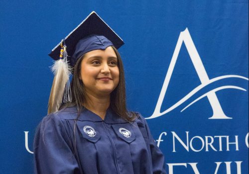 Student in graduation cap and gown